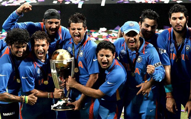 India's 2011 World Cup winning team holding the trophy, Sachin Tendulkar among them