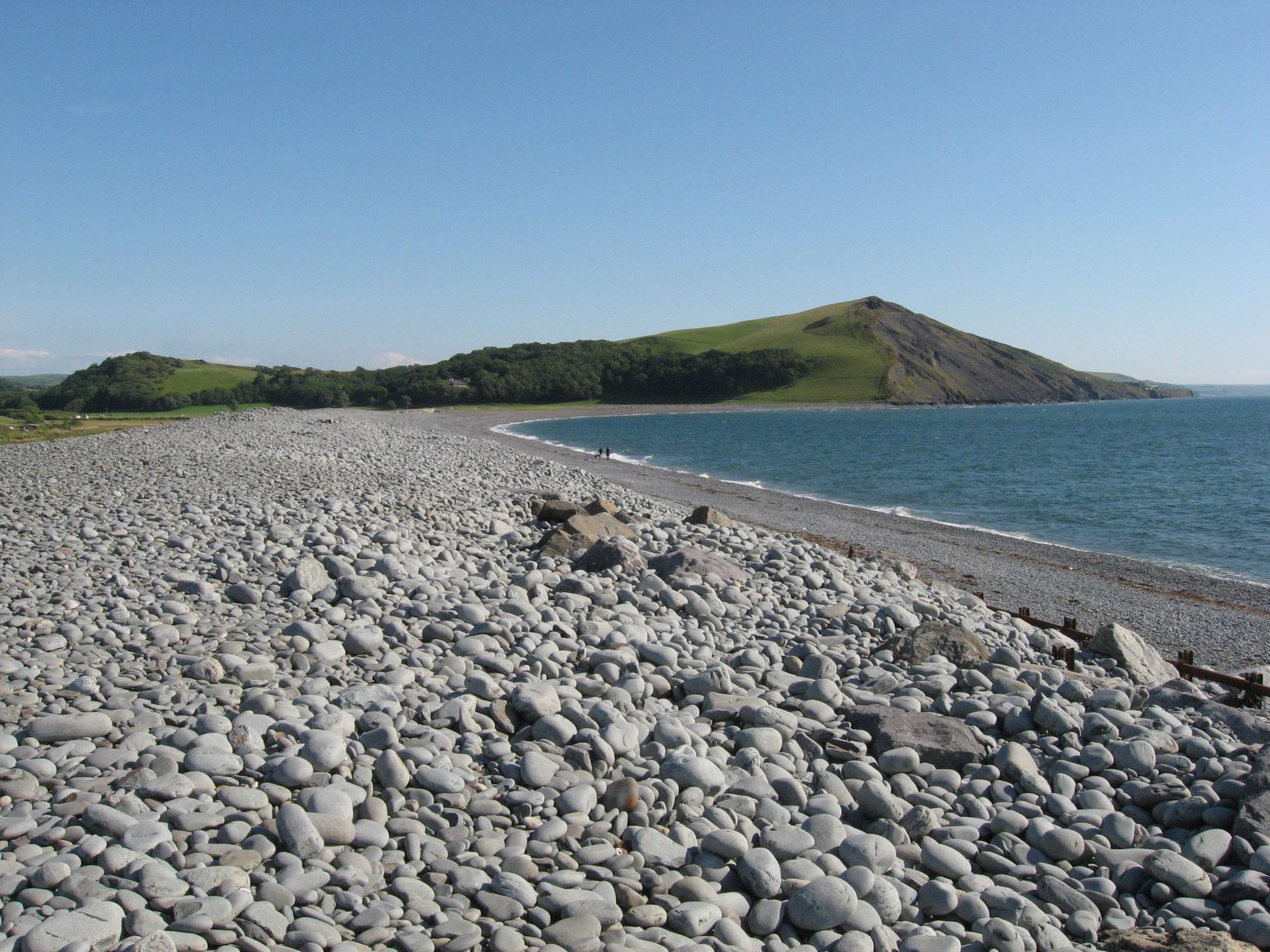 The long shingle spit of Tan-y-Bwlch beach running towards Pen Dinas hill, south of Aberystwyth
