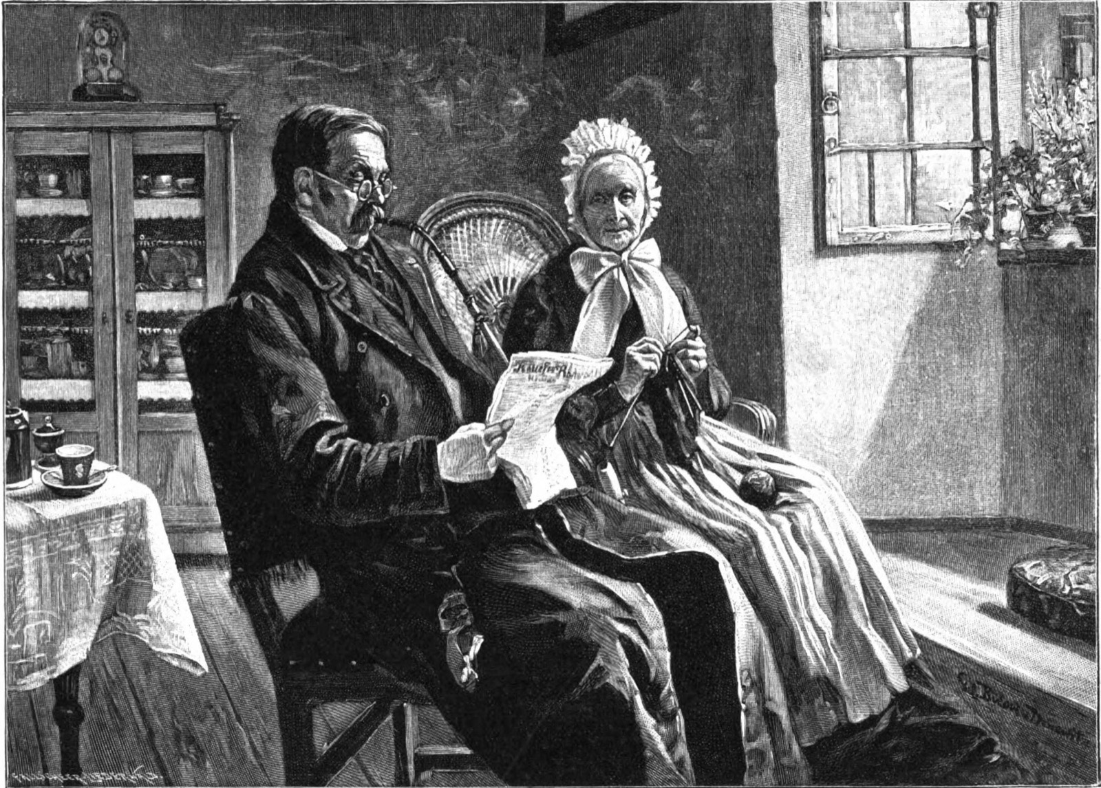 People indoors, one of them reading a newspaper