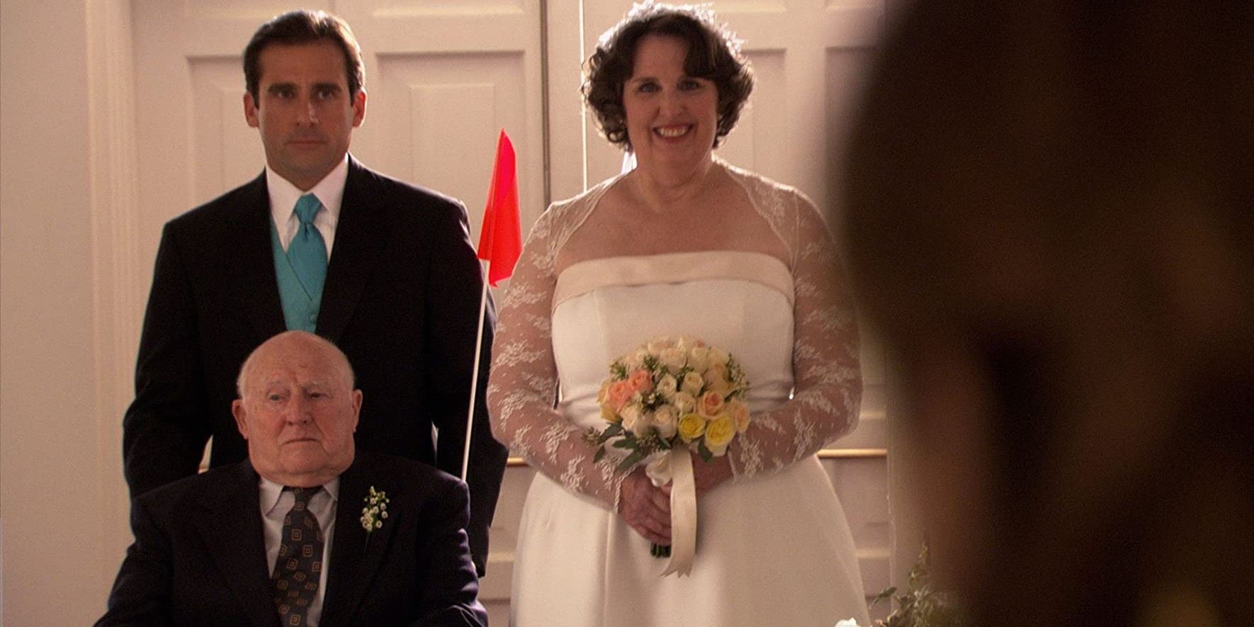 Michael pushing Phyllis's father's wheelchair down the aisle