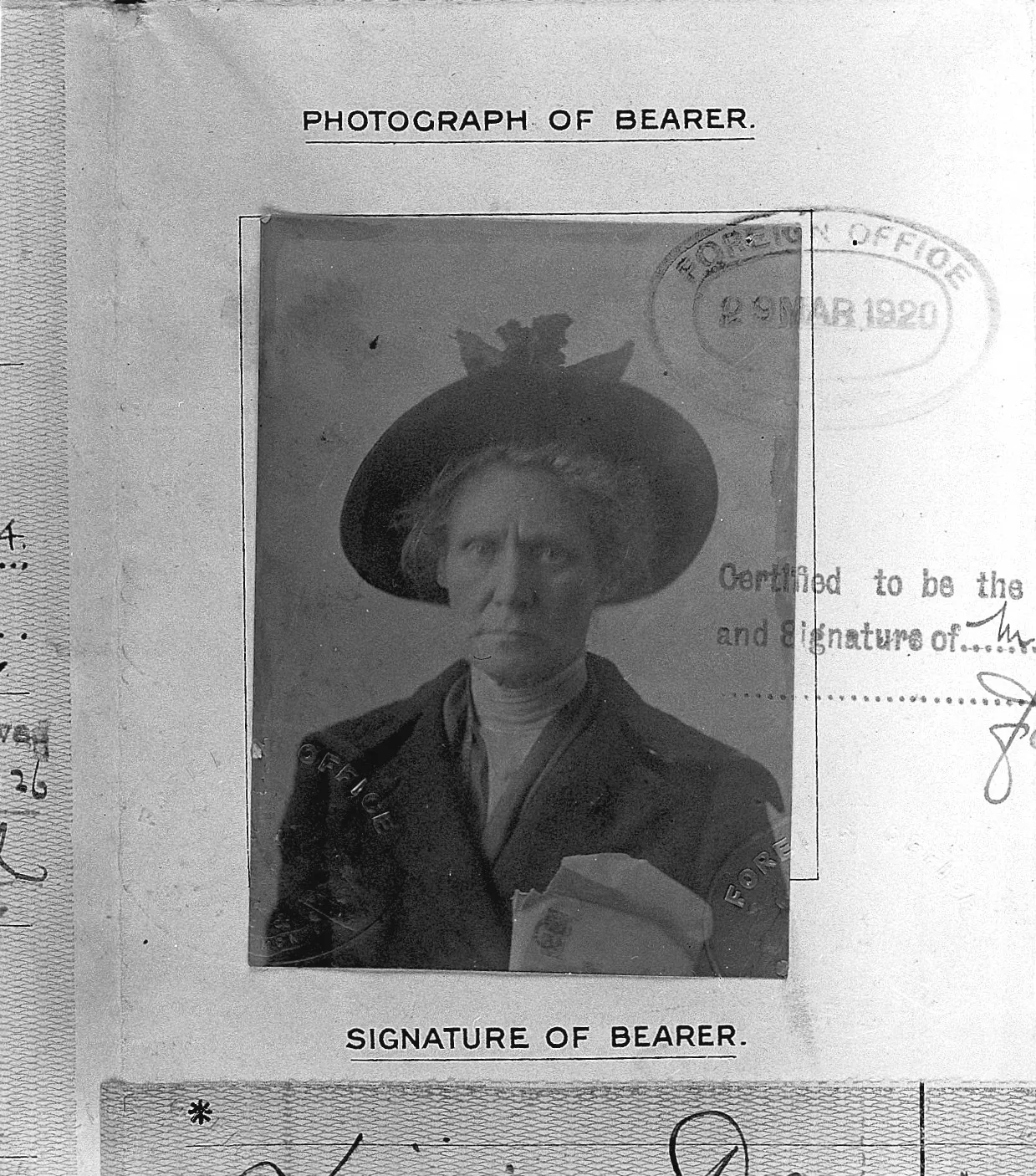 Passport photograph of bearer, 1920, with Foreign Office stamps