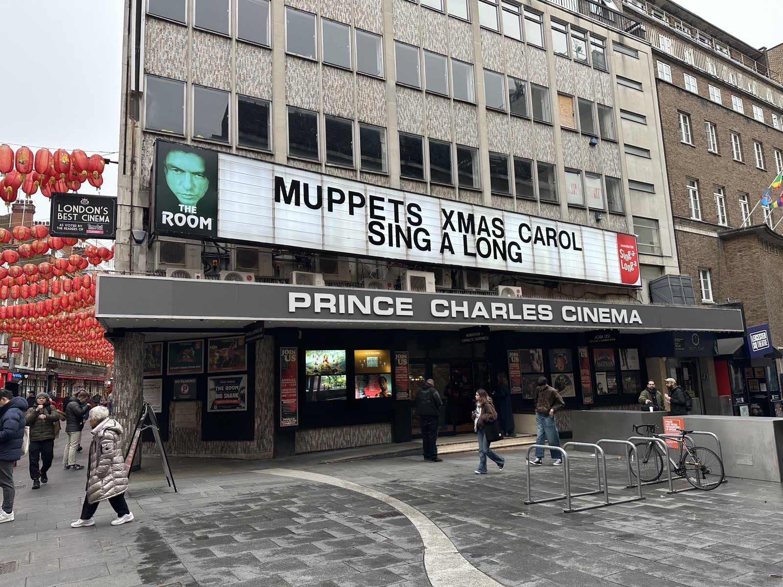 The cinema on a wet December day, with its letter board reading Muppets Xmas Carol Sing A Long.