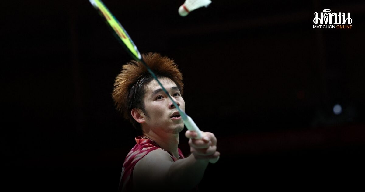 Kunlavut Vitidsarn, with bleached orange hair and a red Thailand shirt, reaches up to play a shuttle during the final