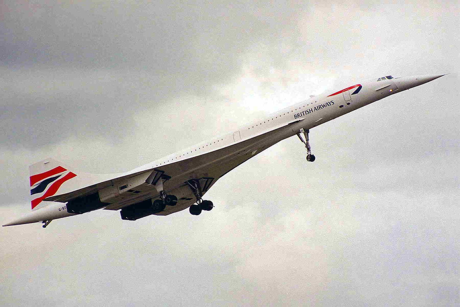 A British Airways Concorde climbing away with its landing gear still down