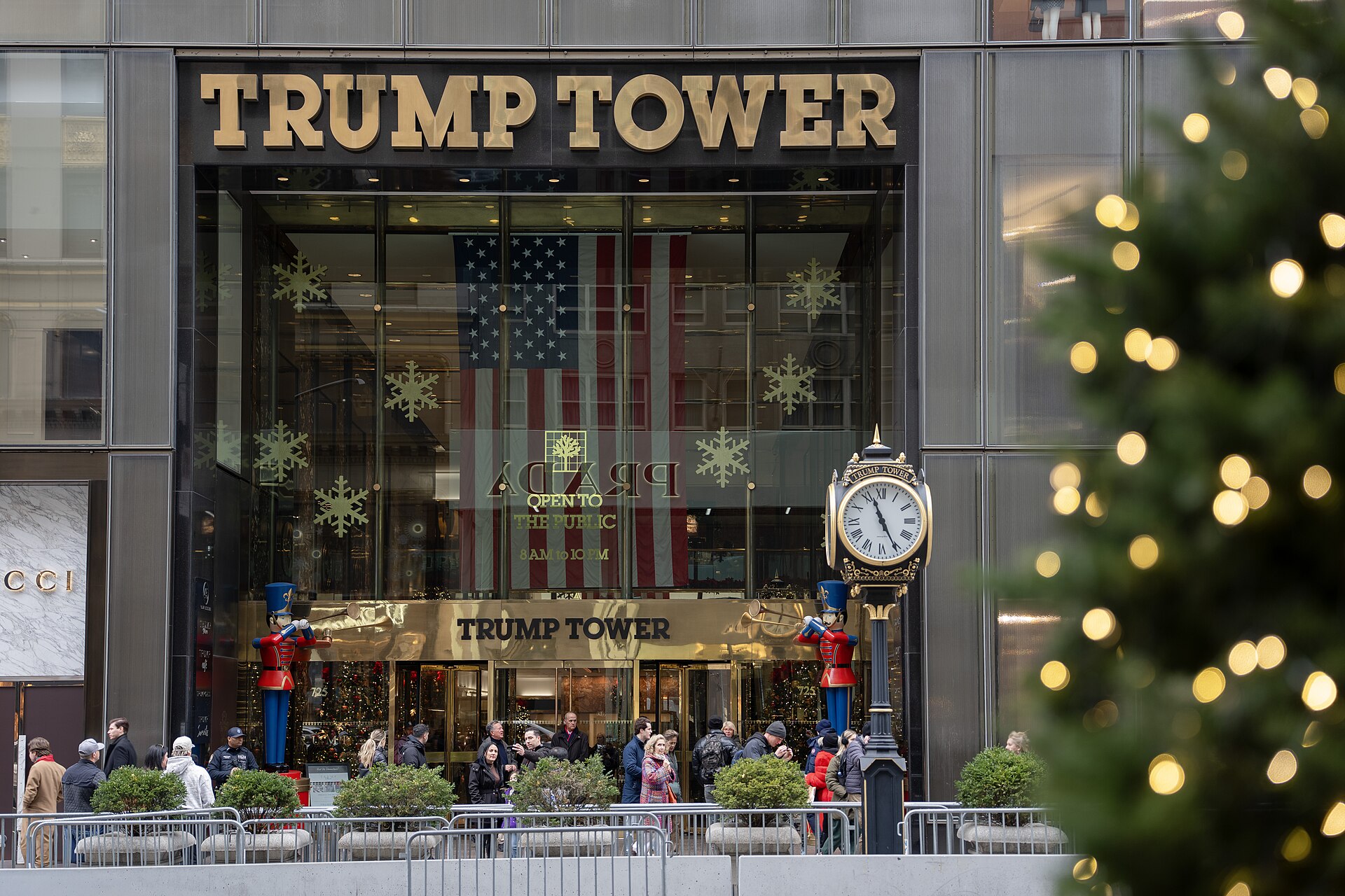 The Trump Tower entrance on Fifth Avenue, New York City, with its gold lettering and the American flag